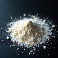 Pile of White Powder on Black Surface Close-up photo