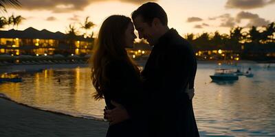 Silhouette of Couple Embracing at Sunset by the Ocean photo