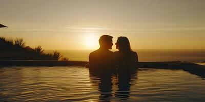 Silhouette of Romantic Couple in Infinity Pool at Sunset photo