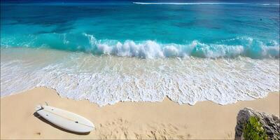 Surfboard on Sandy Beach with Turquoise Ocean Waves photo