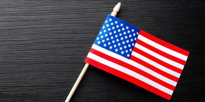 Small American Flag on Dark Wood Background Patriotism Image photo