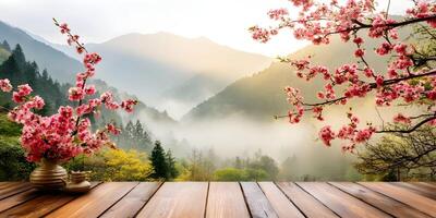 Pink Flowers in Vase Wooden Table Misty Mountain Spring Landscape photo