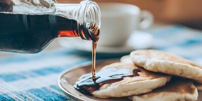 Pouring Maple Syrup on Pancakes Breakfast Food Photography photo
