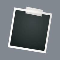 black photograph frame with tape in isolated background vector