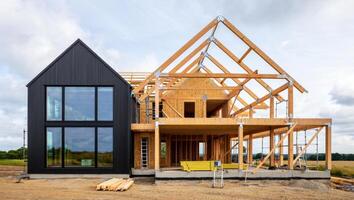 Home Construction Scene Featuring Exposed Frame and Metal Siding photo