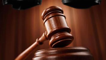 Judges gavel in action during a court decision photo