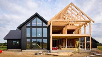 Architectural Contrast of Finished and Unfinished Barnhouse photo