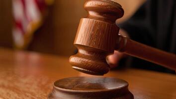 Rich wood texture of a gavel in dramatic legal setting photo