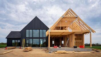 Half-Built Barn-Style Home with Exposed Wooden Frame photo