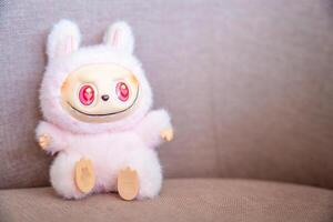 Budva, Montenegro - June 12, 2025. LaBubu collectible figure from Pop Mart on soft pink fabric background. Studio-style shot highlighting popular designer toy. High quality photo