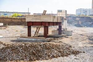 Plate load test in progress with heavy weight applying static pressure on soil. Geotechnical procedure to assess ground settlement and load-bearing capacity. High quality photo
