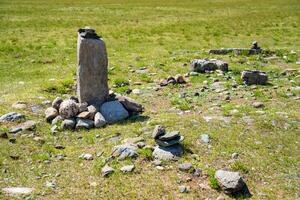 Vertical stone slabs known as Inin steles forming a sacred site near Chuysky Trakt Altai Russia. Spiritual monument used for prayers and worship by Altai people. High quality photo