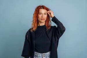 Woman is in the studio against background photo