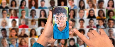 A person is engaging with a smartphone displaying a face scanning feature. photo