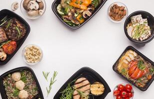 Advertisement concept. Frame of healthy food in black boxes with blank space on white background photo