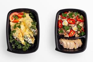 Healthy home made meal in plastic conteiner for taking away lunch, top view, isolated photo