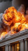A large fire is coming out of the top of a building photo