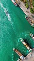 An aerial view of a harbor with boats and a dock photo
