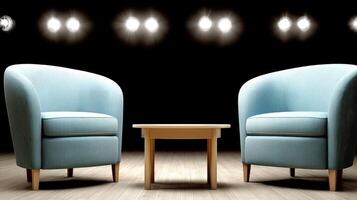 Two chairs and a table in front of a spotlight photo