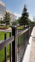 A black fence with a white picket photo