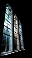 A dark room with three windows and a cross photo