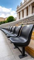 Row of empty seats in front of a building photo