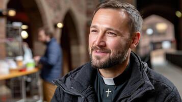 A man with a beard and a priest's collar photo