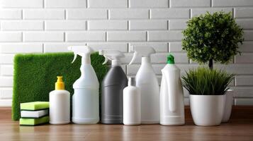 Various cleaning products and cleaning supplies on a wooden floor photo