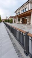 A walkway with a railing and a building in the background photo