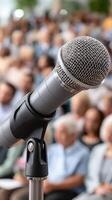 Microphone in front of a crowd of people photo