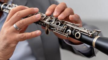 A man in a suit is playing a clarinet photo