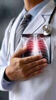 A doctor holding a chest x - ray with a stethoscope photo