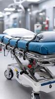 A hospital bed with blue sheets on it photo