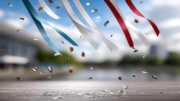 Ribbons and confetti on a wooden table with a blue sky photo