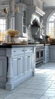 A large kitchen with white cabinets and a large island photo