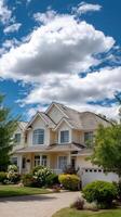 A large house with a driveway and a large garage photo