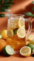 A pitcher of iced tea with lemons and oranges photo