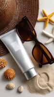 Sunscreen, sunglasses, and starfish on a white background photo