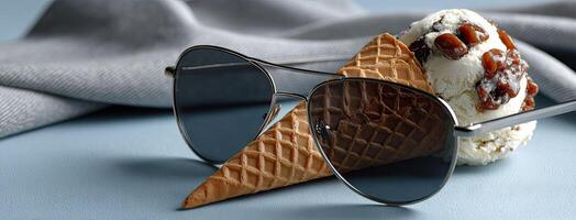 A pair of sunglasses with ice cream and a cone photo