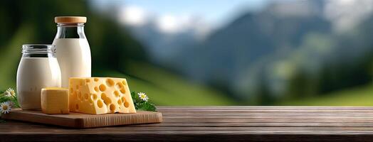 A bottle of milk and cheese on a table photo