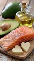 Salmon, avocado, and butter on a cutting board photo
