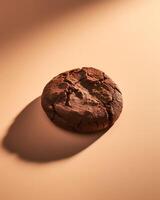 Chocolate Cookie with Shadow on Beige Background photo
