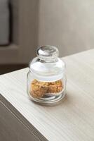 Cookies in a jar hint at a sweet break in a quiet corner. photo