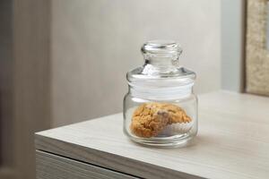 Cookies in a jar hint at a sweet break in a quiet corner photo