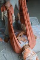 Wellness session with gentle stretching and relaxation practices in a serene indoor setting during daylight hours... photo