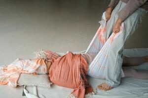 Wellness session with gentle stretching and relaxation practices in a serene indoor setting during daylight hours.. photo