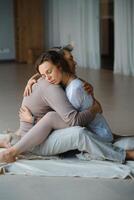 Couple practicing intimate hugging and emotional connection in a serene indoor space during a wellness retreat photo