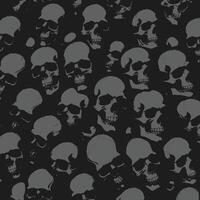 a black and white pattern with many skulls vector