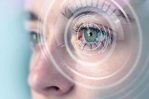 Close-up view of a person's eye with digital overlay indicating technology and vision enhancement concepts photo