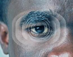 Close-up of a human eye with graphical overlay highlighting pupil and iris details during an optical analysis session photo